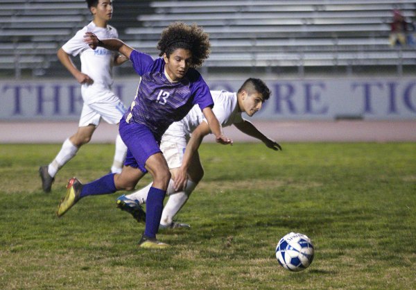 Lemoore's Jovani Benavides (no. 13) steals the ball in 3-1 win over visiting Monache Tuesday night.